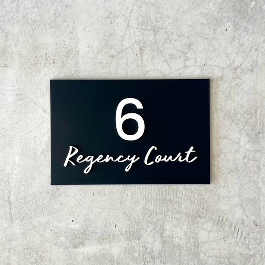 house number with street in a script font