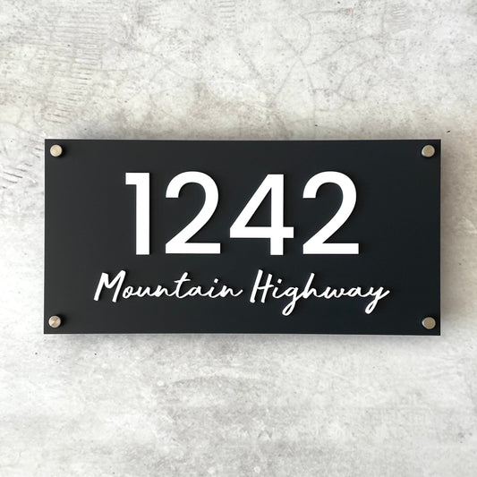 floating house number with street in a script font