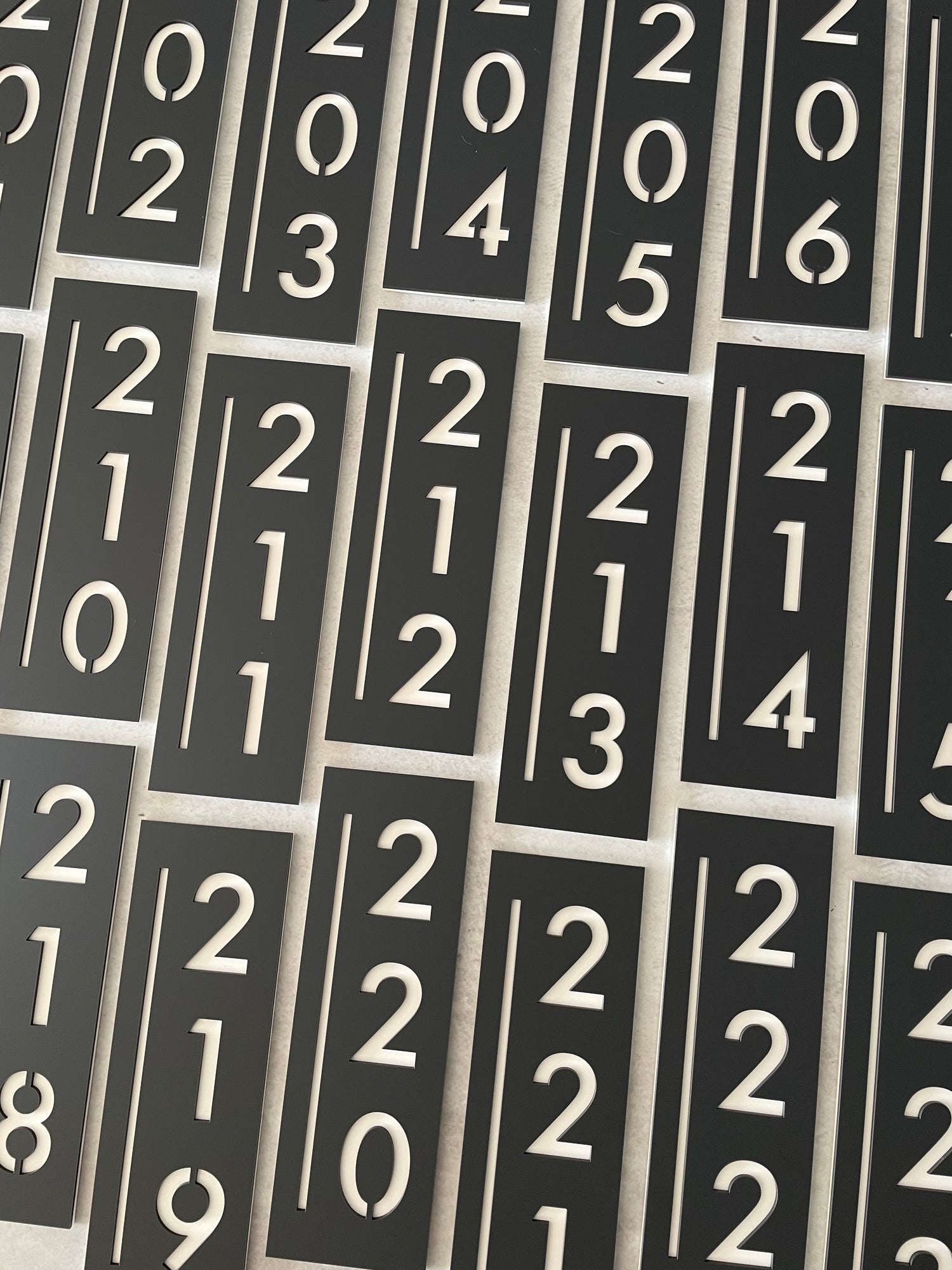 group of contemporary apartment numbers made from laser-cut acrylic