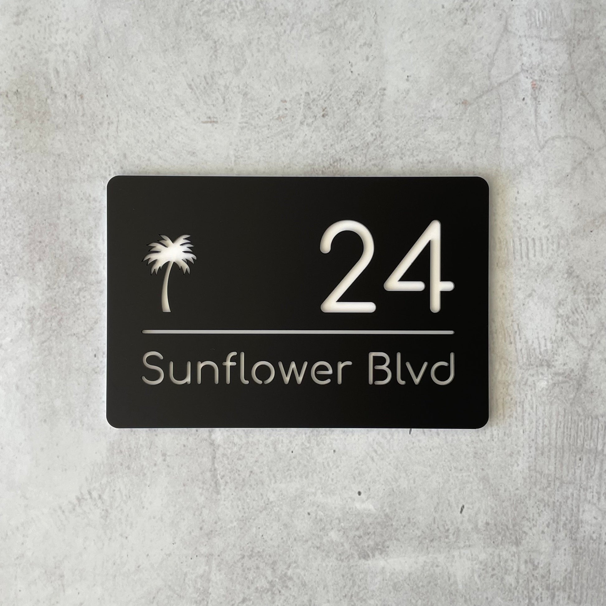 modern acrylic house number sign with palm tree detail