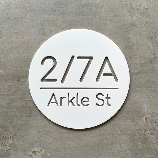 20cm circle house number with street. Single layer white acrylic with cutout lettering.