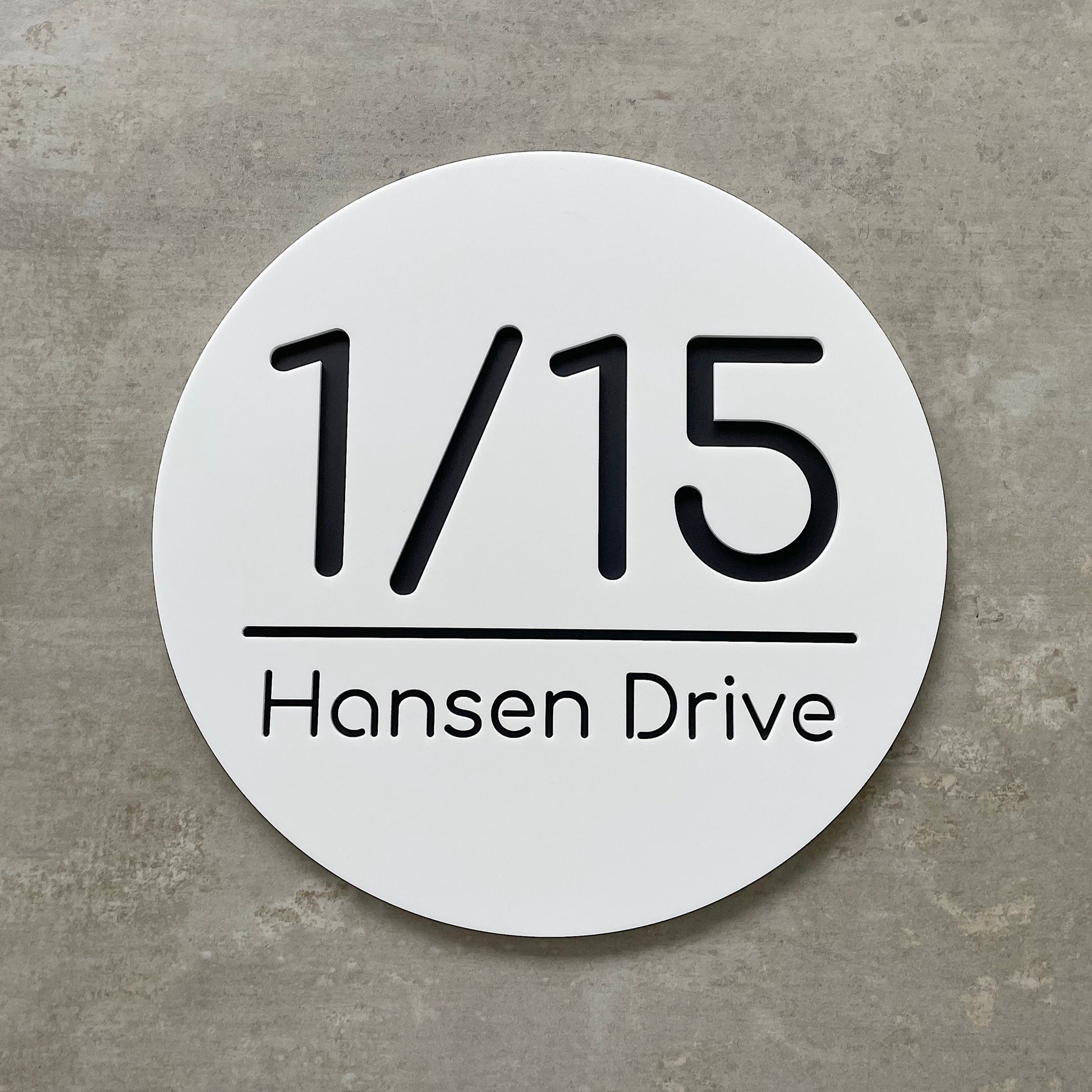 Round white address plaque for added street appeal