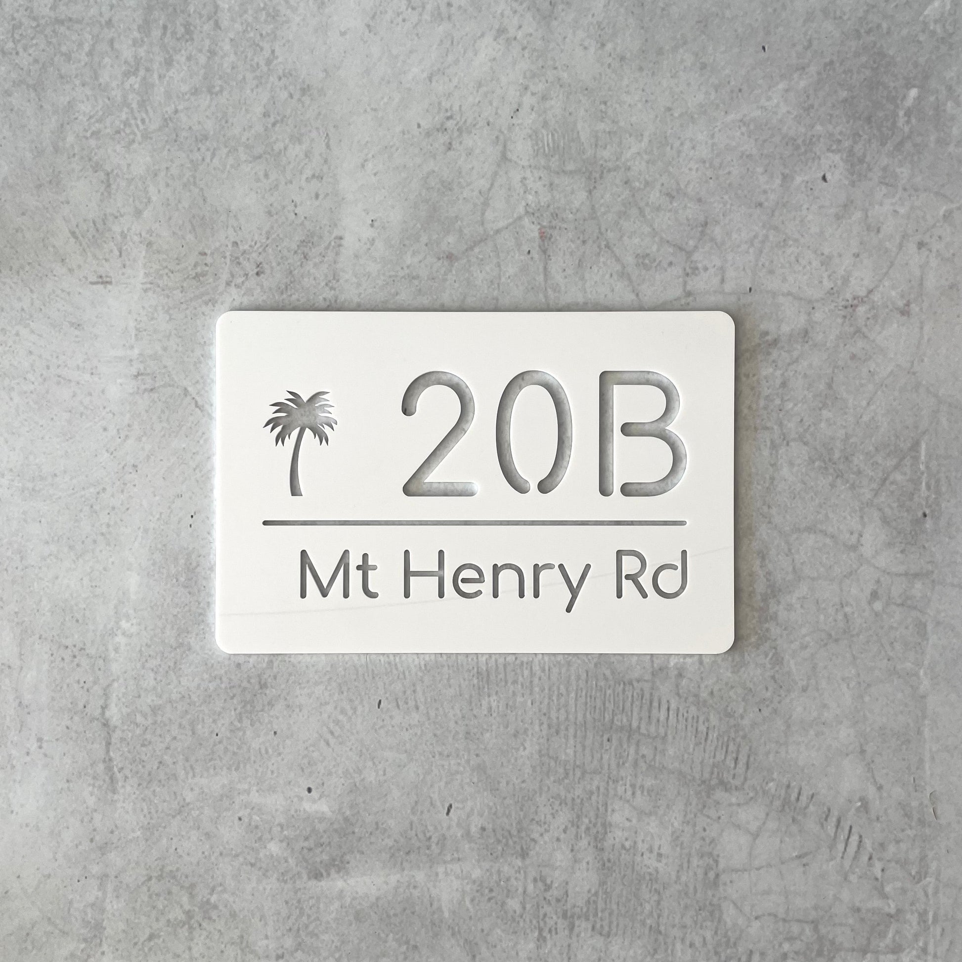 Contemporary house number sign in white cast acrylic with palm tree icon, made in Australia