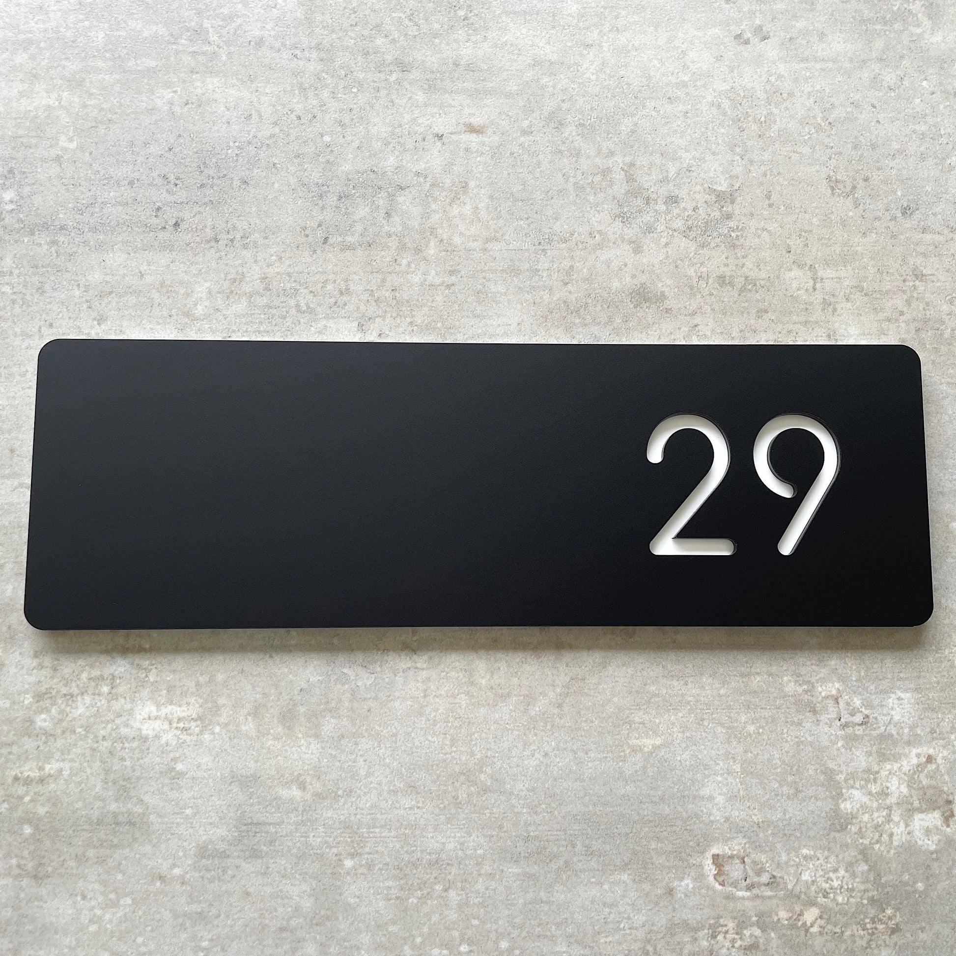 contemporary house number plaque in black and white
