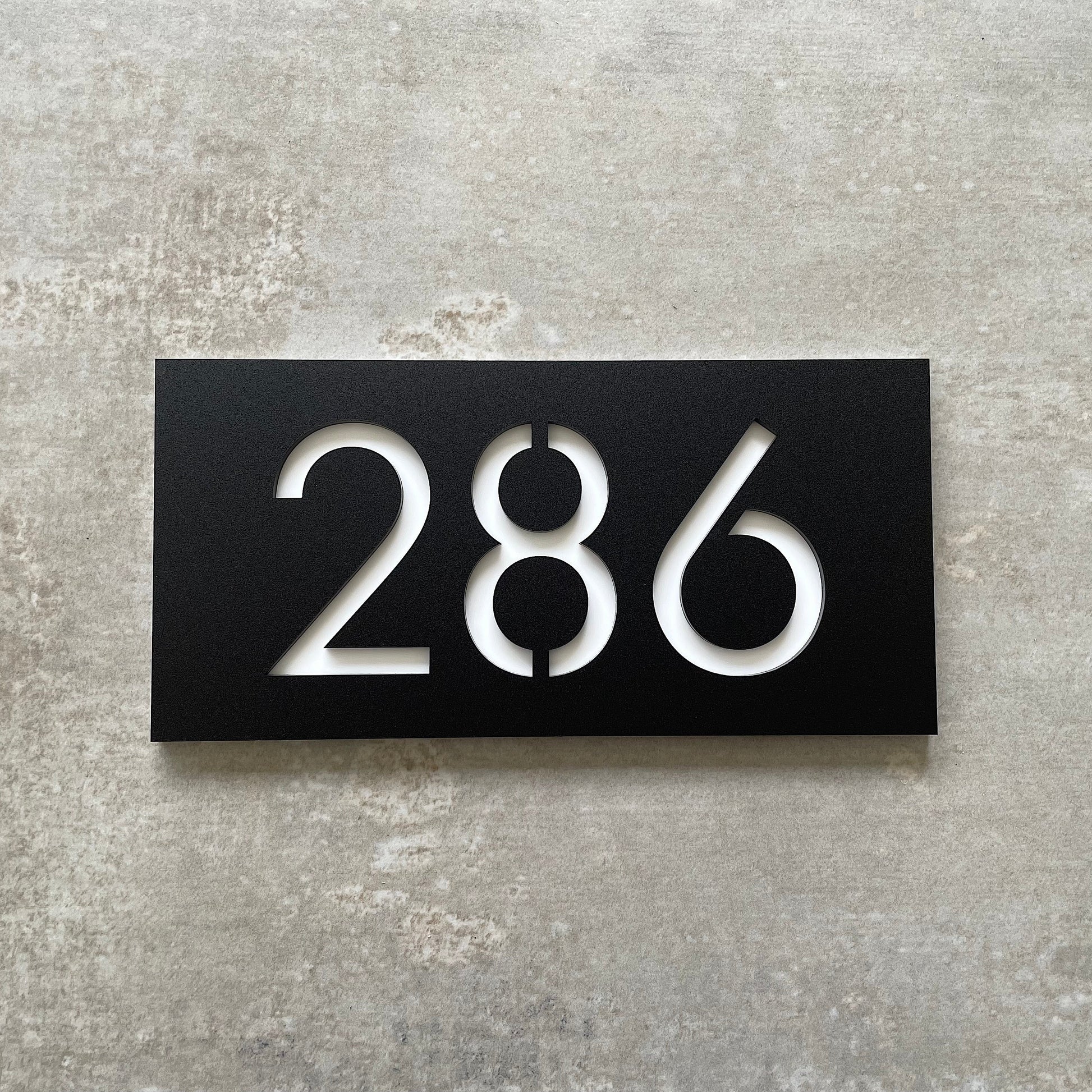 Small house number for mailbox or letterbox in black with white lettering