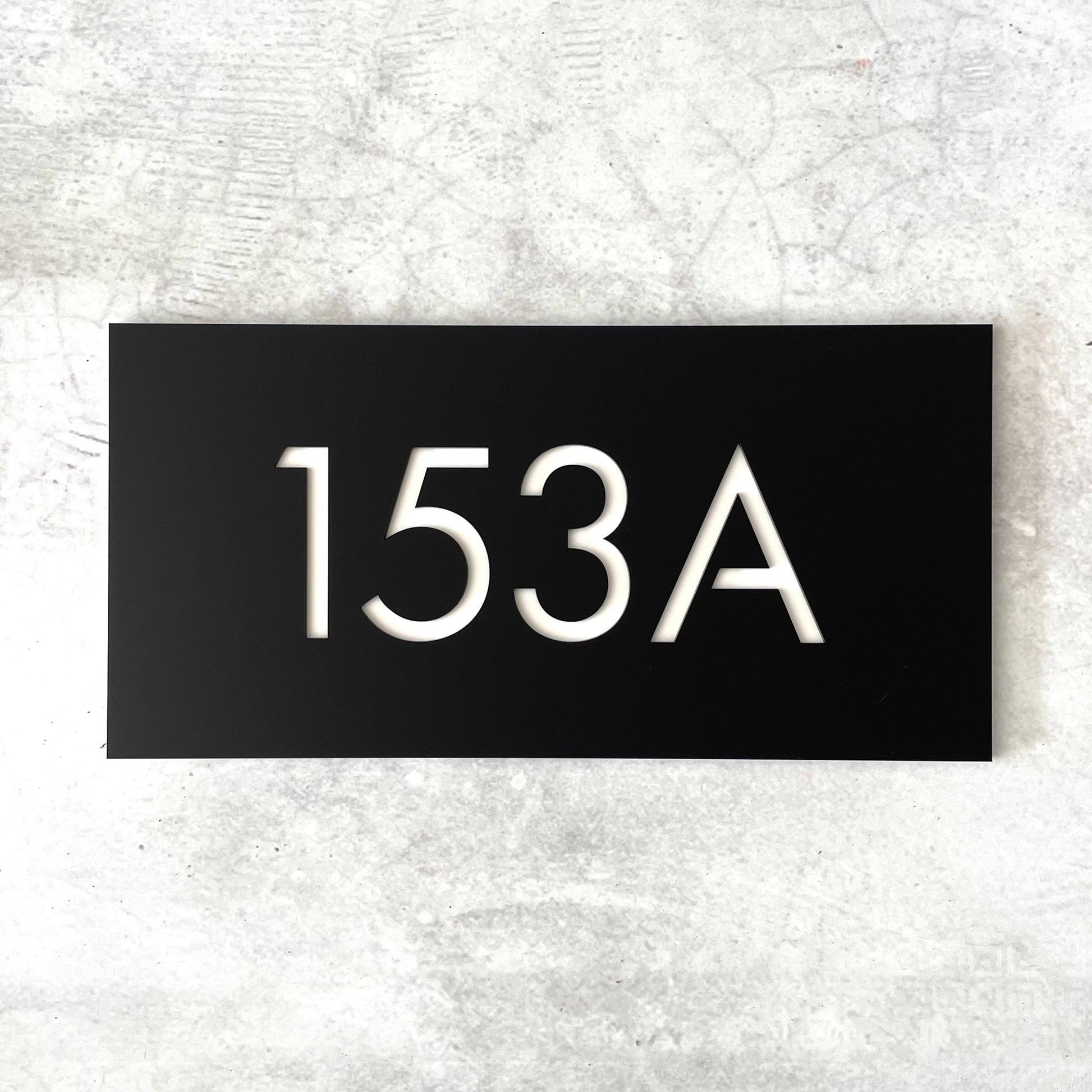 Oversized modern house number plaque in black and white