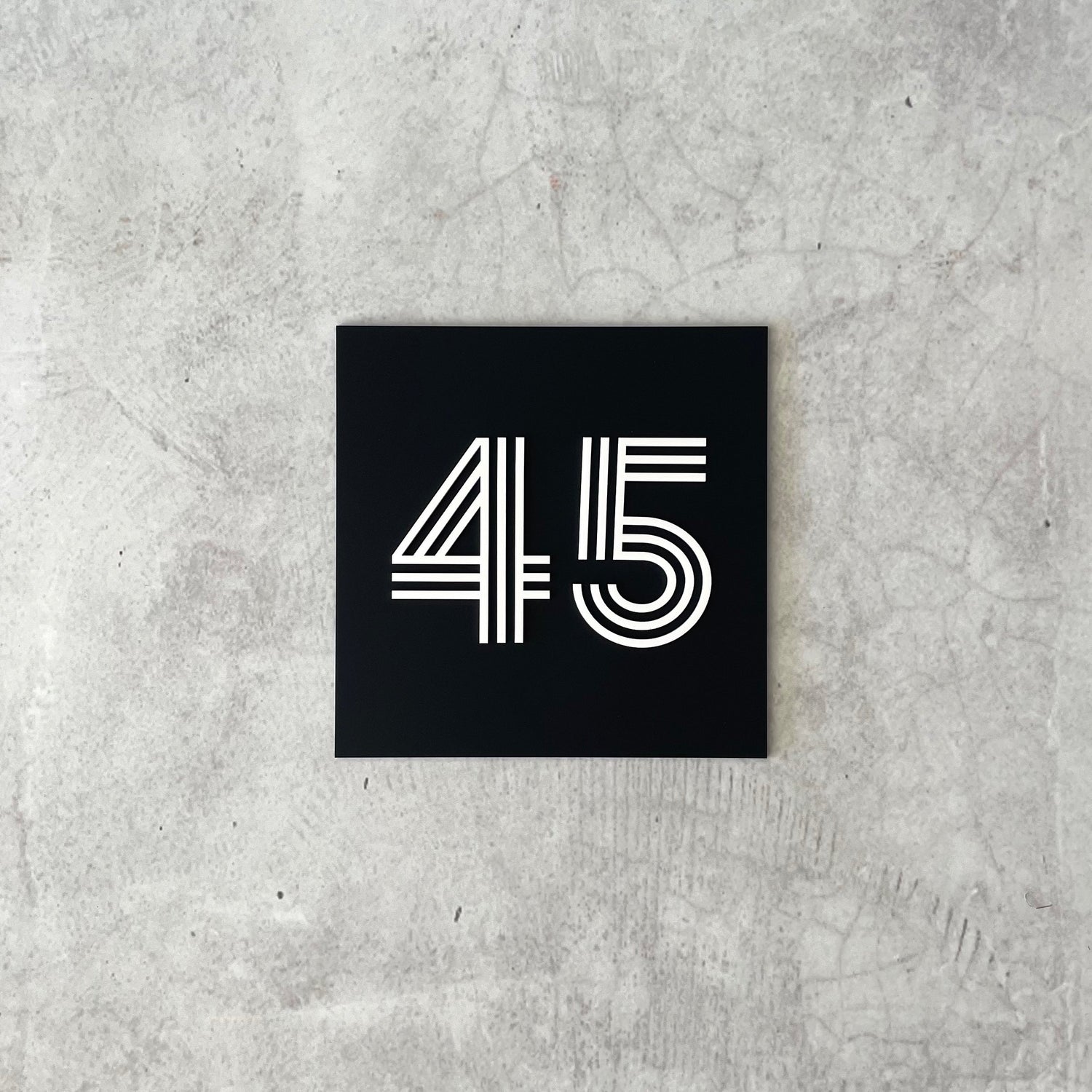 Three-dimensional house number sign with white text, premium outdoor signage