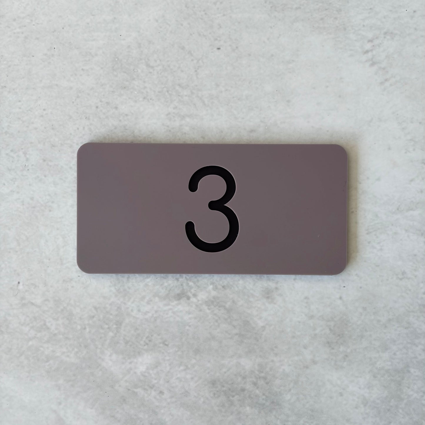 grey apartment numbers with black lettering