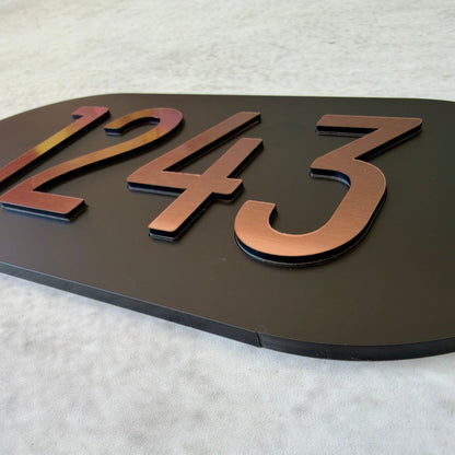 apartment number sign with brushed copper lettering