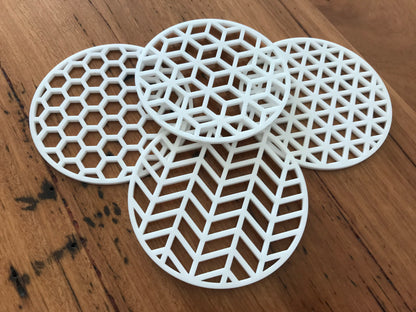set of 4 modern geometric coasters made of white acrylic